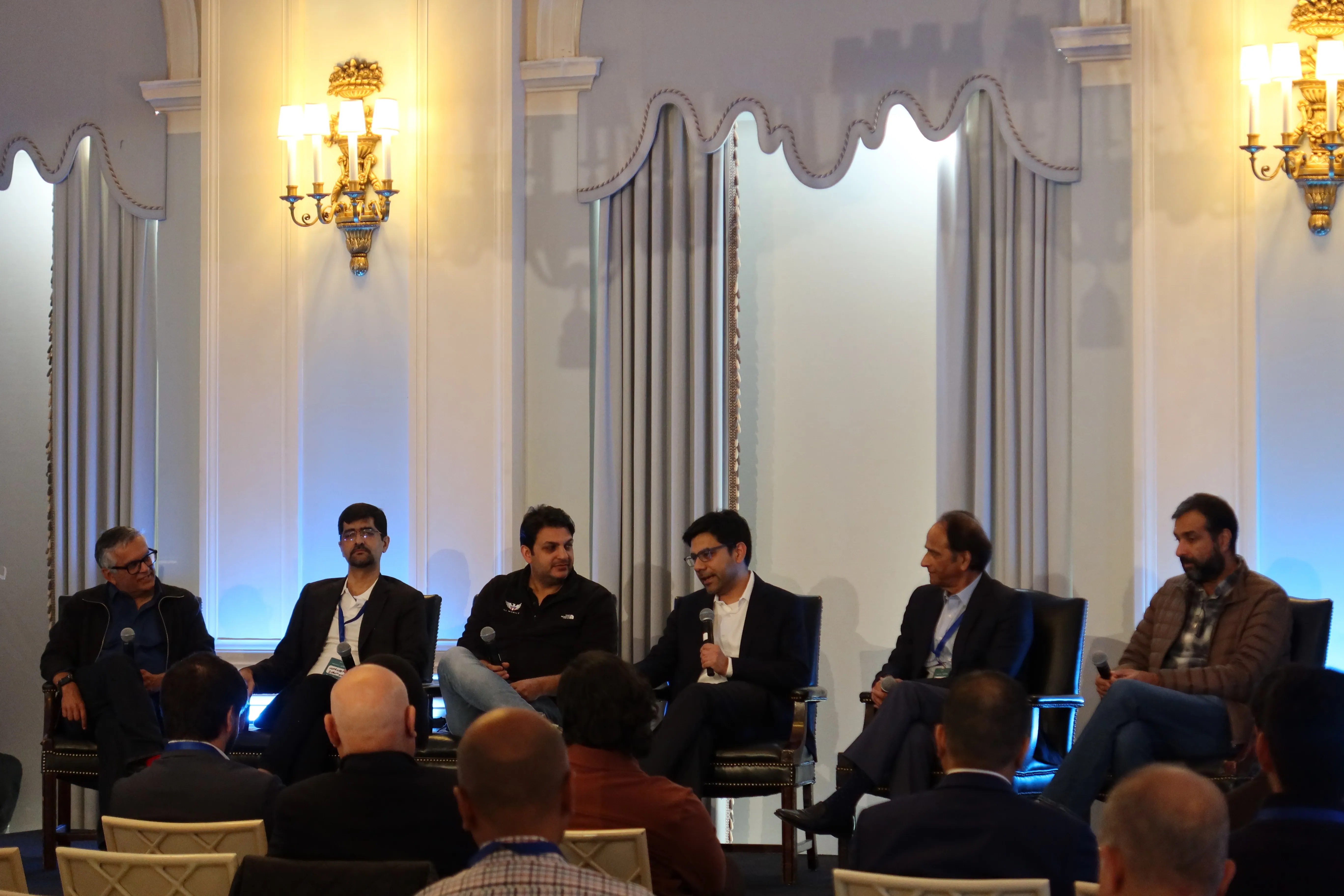 Panelists on the Rebuilding Industries in the AI Era panel, including Uzair Gadit, at Paklaunch’s UNConference26.2 in New York.