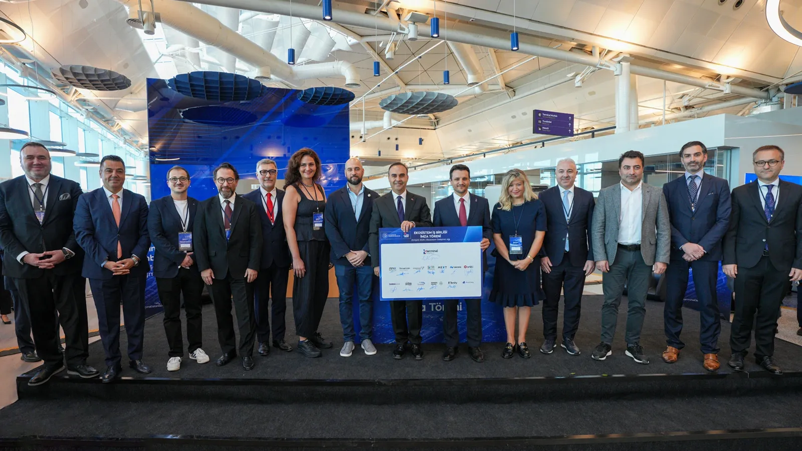 Representatives of partner institutions on stage holding the signed Terminal İstanbul memorandum of understanding.